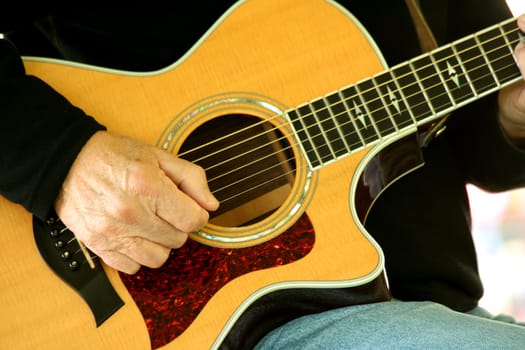 A Man strumming guitar