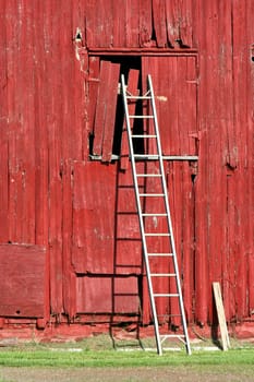 A ladder on a old red bard