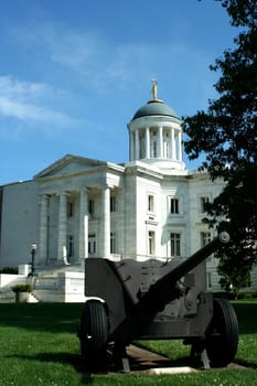 A Cannon in frount of a courthouse