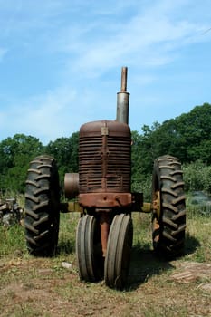A Old rusty farm tractor