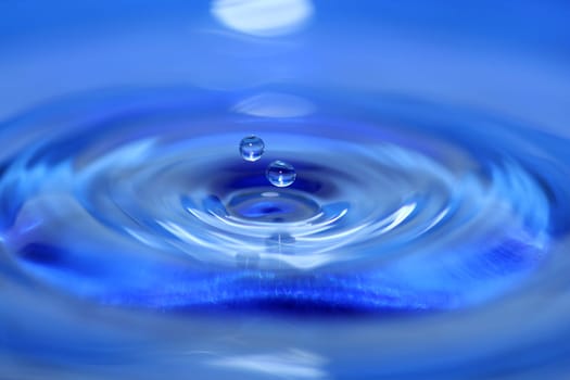A two Blue water droplets falling