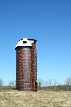 A old silo against blue sky