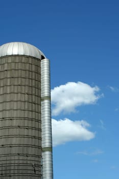 A grain silo against blue sky