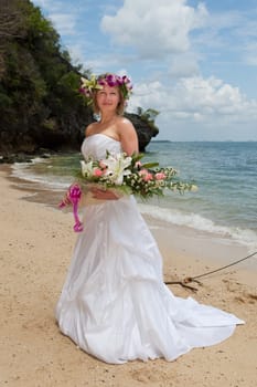 Bride on the beach,in a white dress by the sea in Thailand