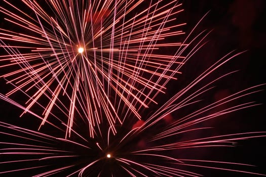 an image of exploding fireworks at night.