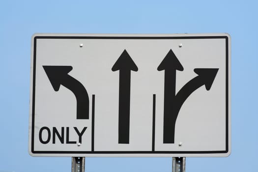 a sign with three arrows on it.
