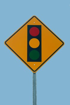 Traffic light sign against a blue sky