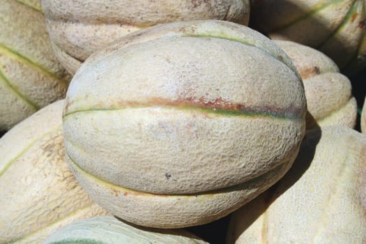 a bunch of Melones at the market