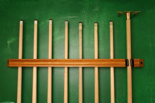 Pool Cues in a wall rack