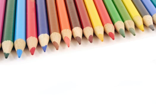 Colored pencils on a white background