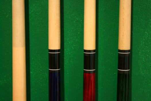 Pool Cues in a wall rack