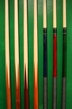 Pool Cues in a wall rack