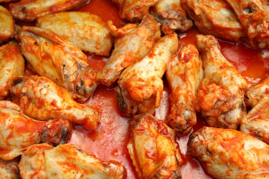 Chicken Wings Cooking covered in sause