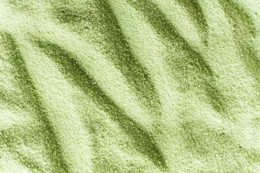 Close-up of green sand with strong contrast pattern
