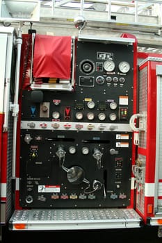 A Fire Truck controls parked outside a firehouse