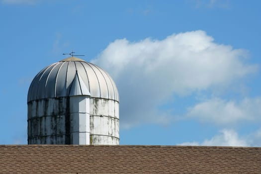 a Grain Silo against a blue sky