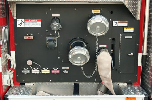 A Fire Truck controls outside a firehouse
