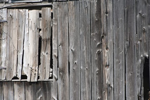 An Old wooden barn with a closed window