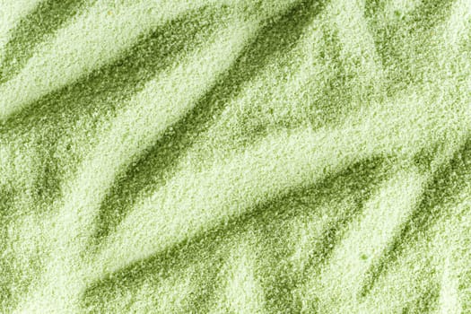 Close-up of green sand with strong contrast pattern