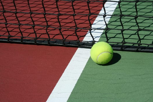 A Tennis Ball inbounds with white line and net