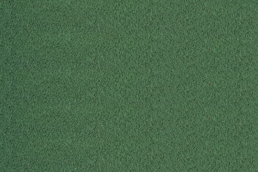 A Tennis ball on a green court