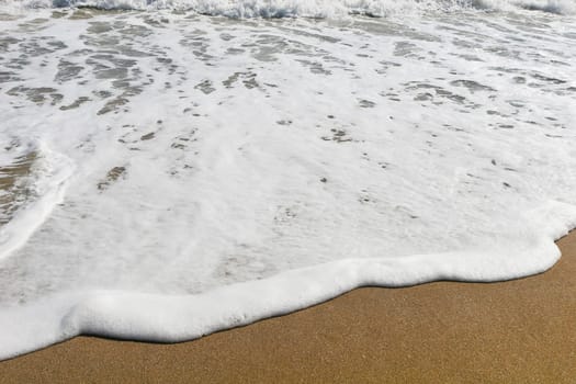 a texture of waves on a beach sand