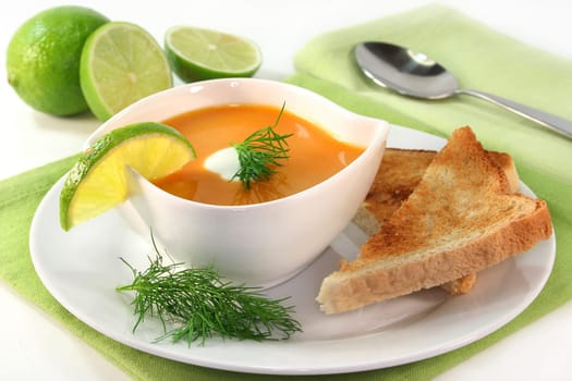 a bowl of salmon cream soup with cream and dill