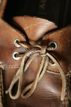 A close up of a deck shoe with laces
