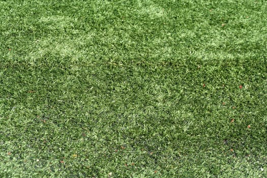 A green Astro turf background