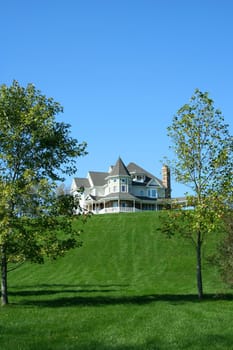 A Beautiful house on a green hill