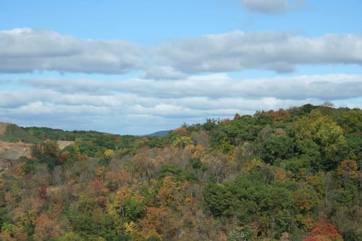 A mountain with changing leaves and sky