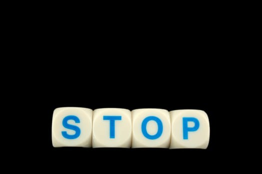 The word stop spelled in blocks isolated