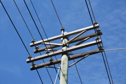 A Telephone Pole against a blue sky