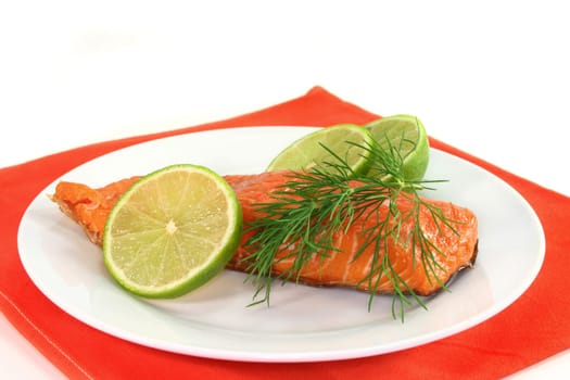 Smoked salmon with lime and dill on a plate