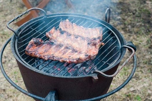 Shot of preparing grilled ribs in outside