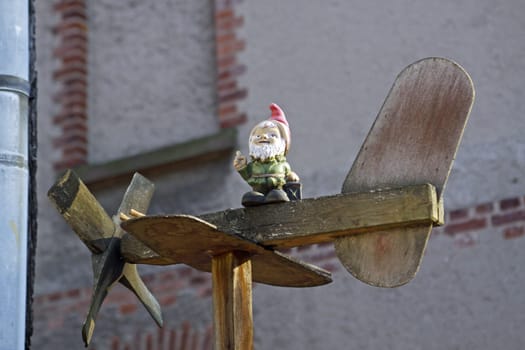 Wooden airplane with garden gnome