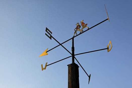 Weather vane with hikers