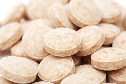 macro of heap of pills isolated on the white background