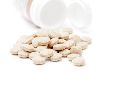 heap of pills isolated on the white background