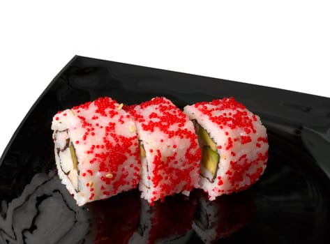 set of sushi rolls over black japanise plate