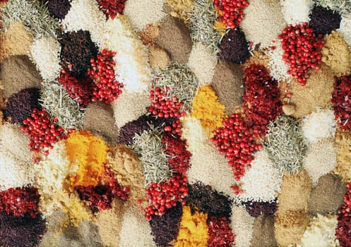 multi colored background of different oriental spices