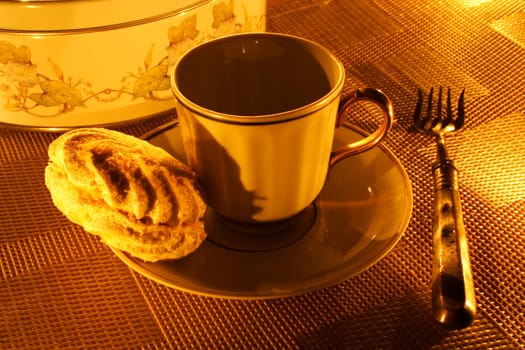 a cup of tea with zephyr on a candle light