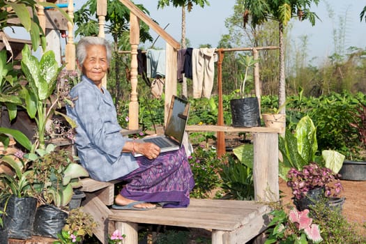 Old woman with laptop,wireless connection in remote places