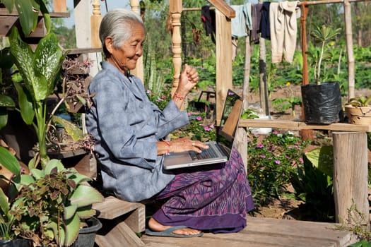 Old woman with laptop,wireless connection in remote places