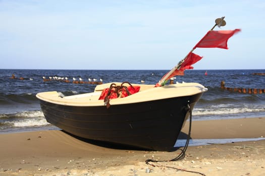 Fishing boat on the beach of the Baltic Sea on the island of Usedom