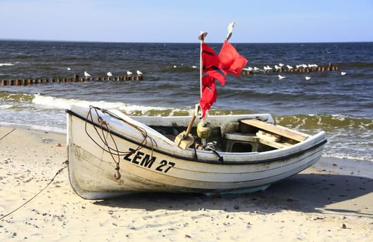 Fishing boat on the beach of the Baltic Sea on the island of Usedom