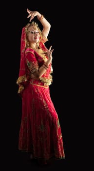 Beauty young girl posing in red traditional indian costume