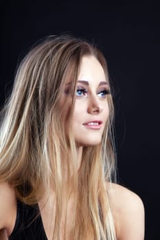 Portrait of Young beauty blond girl look at light