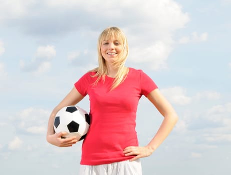 Young woman with soccer ball