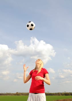 Young woman with soccer ball